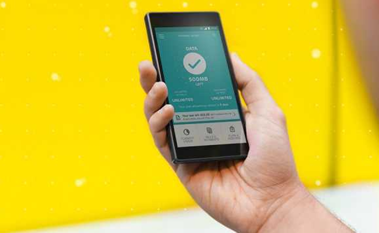 EE £2.7m fine - Man holds EE phone stock 