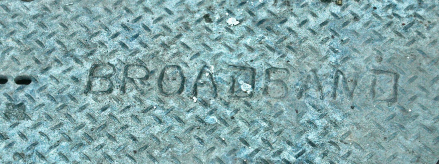 photo of a manhole cover with the word broadband