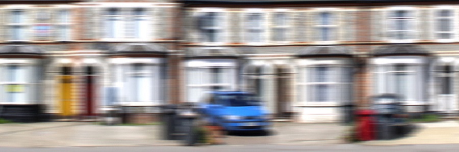 blurry photo of row of houses