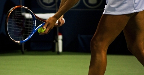 Photo of a tennis player serving